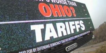 Swing-state billboards use football trash talk to call foul on tariffs