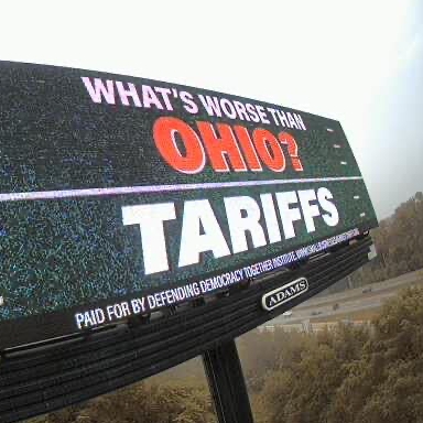 Swing-state billboards use football trash talk to call foul on tariffs