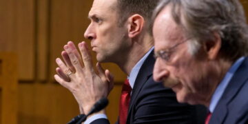Fed official warns persistent inflation could require more rate hikes — and economic pain
