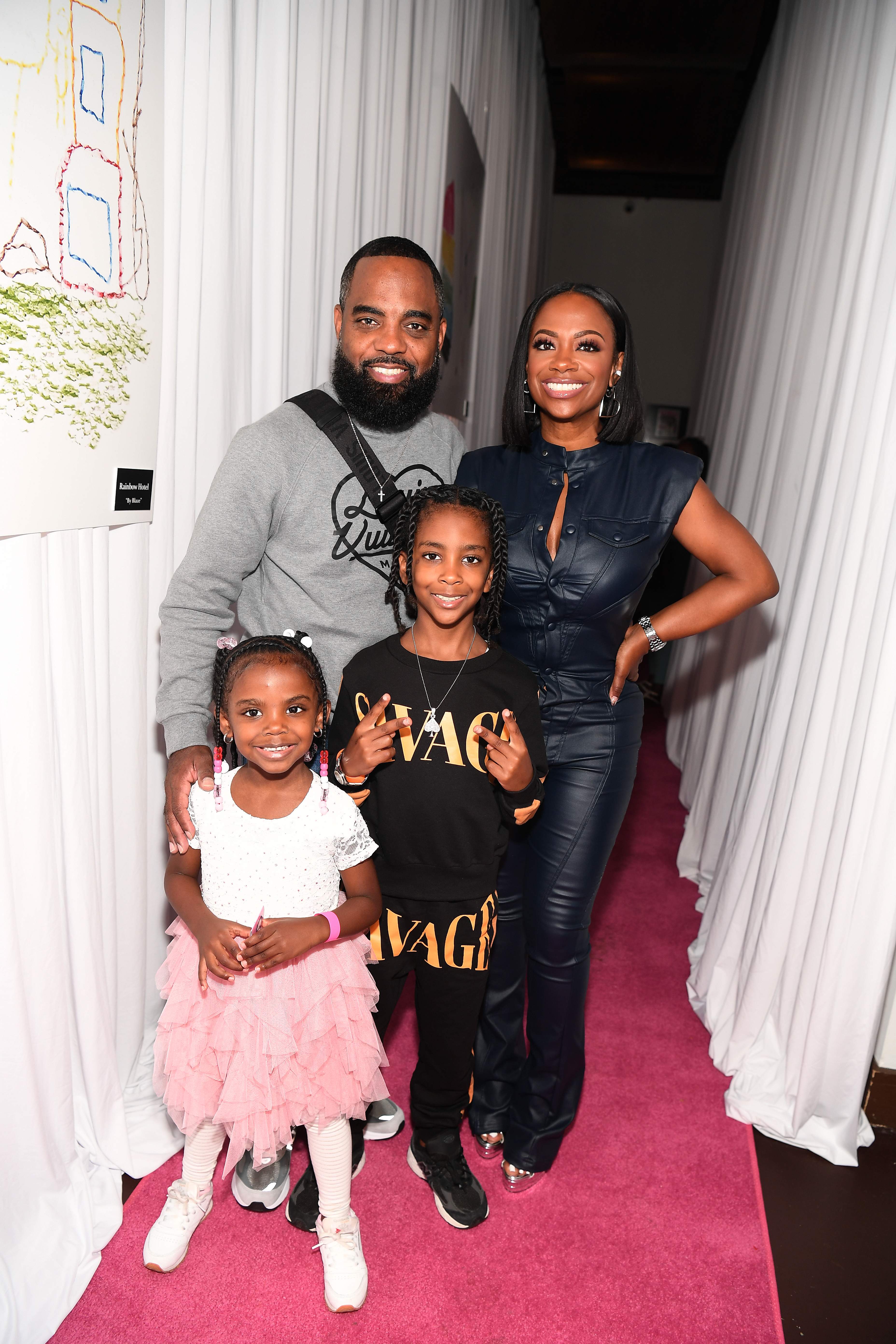 Todd Tucker, Blaze Tucker, Ace Tucker and Kandi Burruss attend The Blaze Book Of Art Exhibit & Auction.