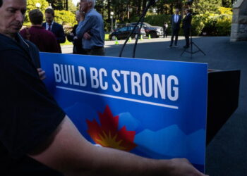 British Columbia leader calls snap election as premier tells voters to say ‘hell no to Trump’
