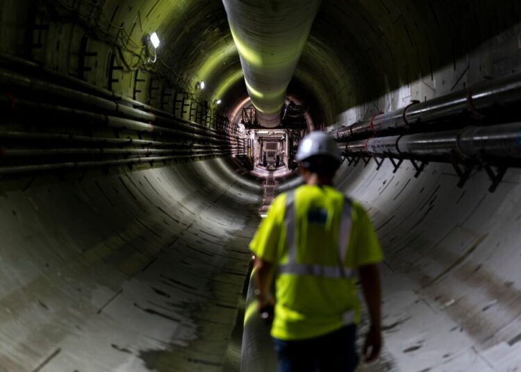 A photographer descends into a massive tunnel meant to protect the Potomac