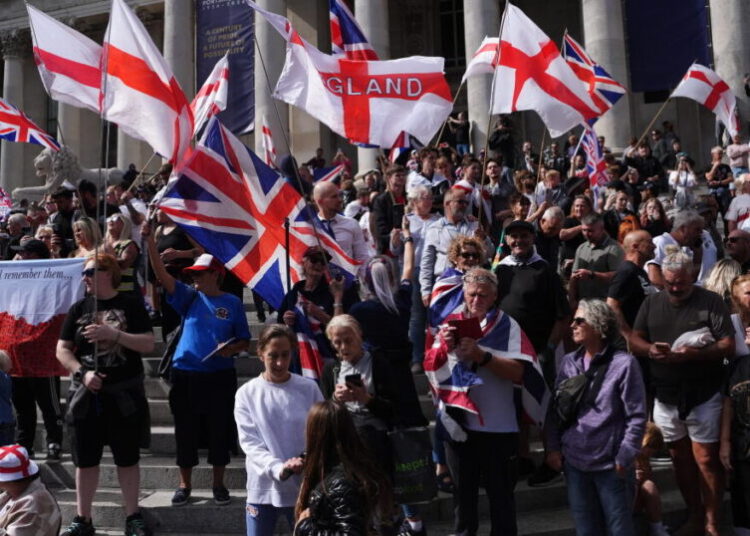 Far-right U.K. activist charged after migrant dinghy slashed in the English Channel