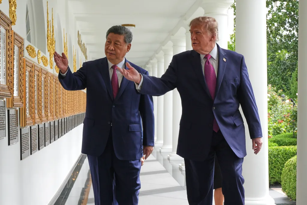 President Donald Trump and China's President Xi Jinping walk along the Colonnade of the White House.