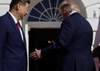 Trump turns back on reporters as they shout questions at him