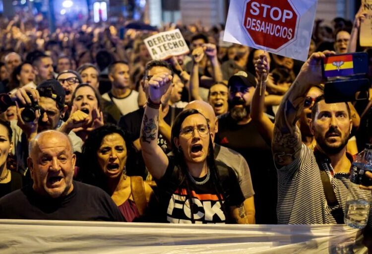 An 87-year-old woman was evicted via stretcher from a Madrid apartment she lived in for decades, sparking mass protest against Spain’s housing crisis