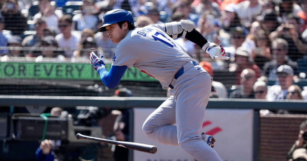 Dodgers defeat Giants in 10 innings to close out regular season with 100 wins