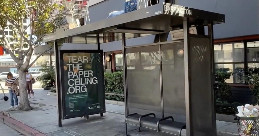 Man makes camp, with his shopping cart, atop Brentwood bus stop shelter