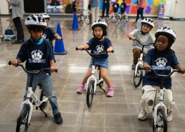 Schools are teaching kindergartners how to ride a bike in gym class