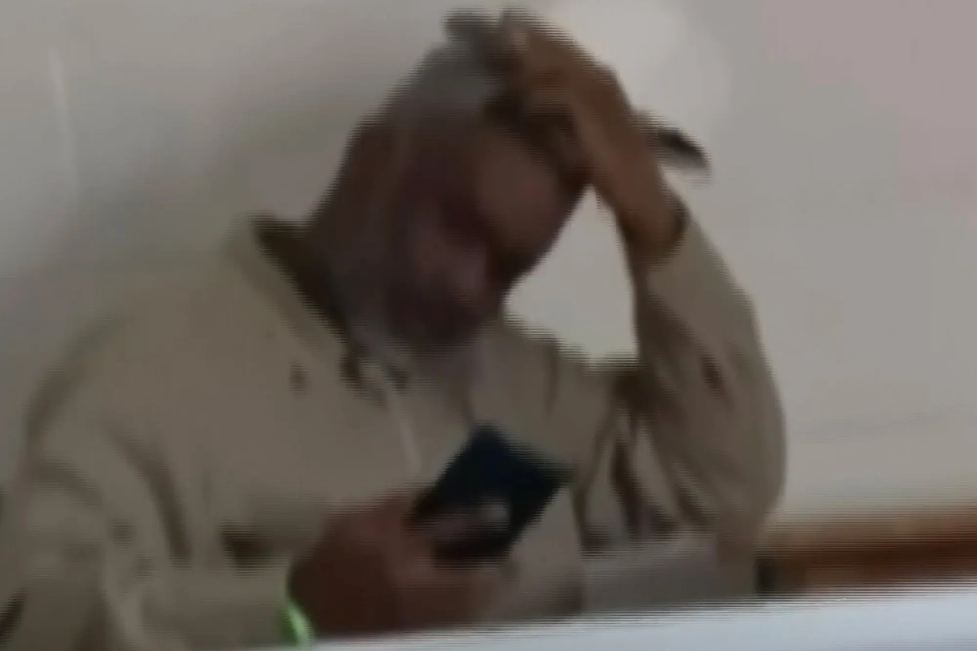 Sean Combs using a mobile phone.