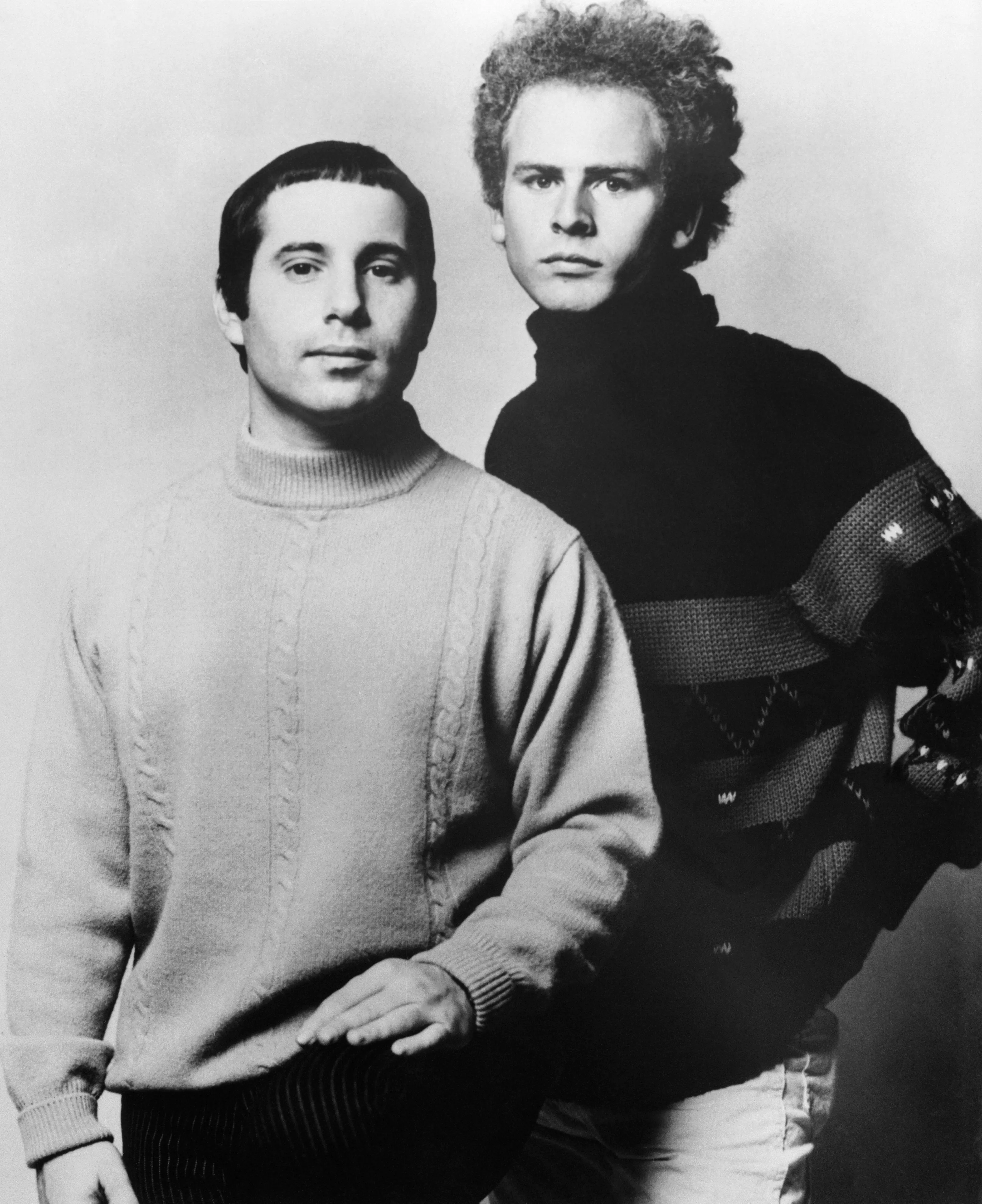 Paul Simon and Art Garfunkel posing for a studio portrait in 1967.