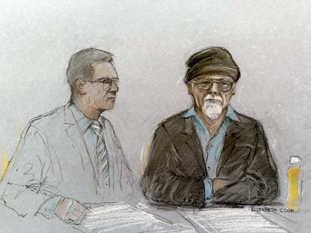 Illustration of Gary Glitter with his solicitor at Southwark Crown Court, appearing via videolink.