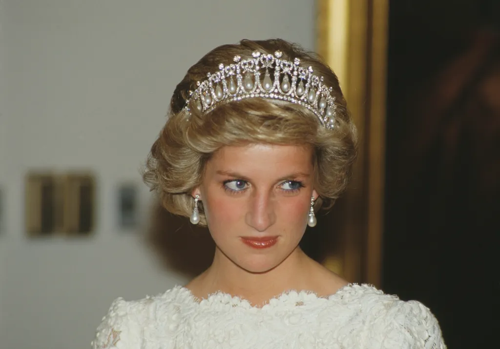 Diana, Princess of Wales, wearing the Queen Mary tiara and a white evening dress.
