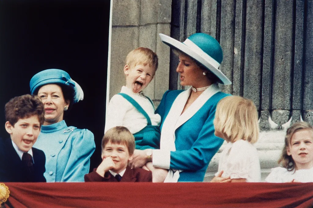 Prince Harry sticking his tongue out on the balcony of Buckingham Palace.