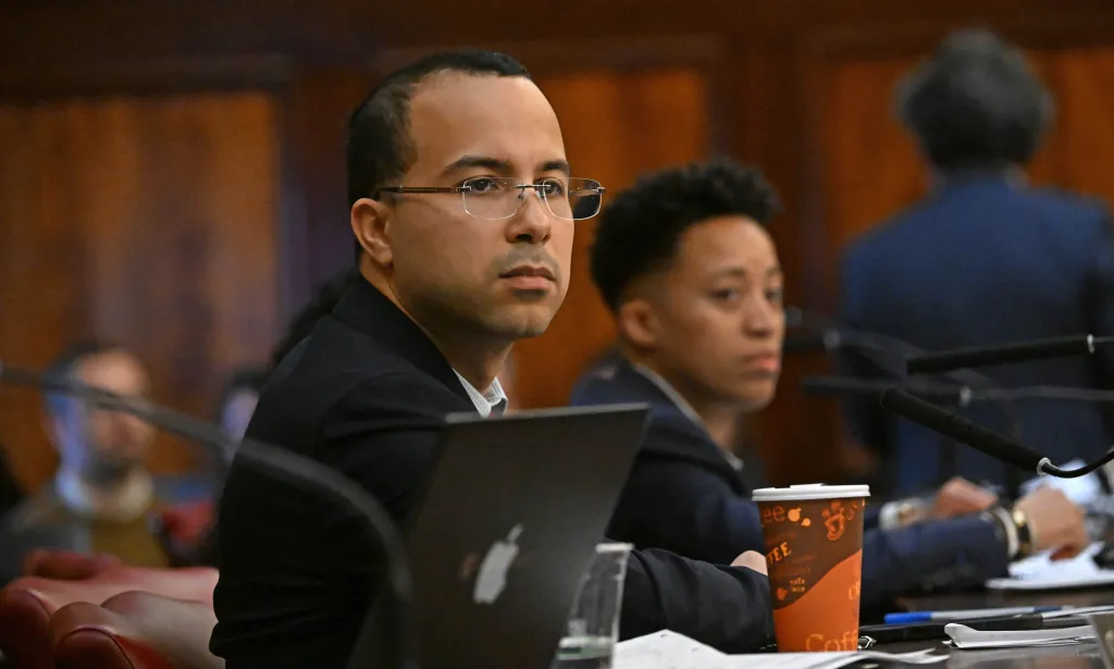 NYC Council Member Oswald Feliz looking ahead during a hearing at City Hall.