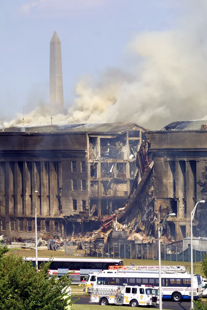 Smoke rises from the damaged Pentagon building after a plane crash.