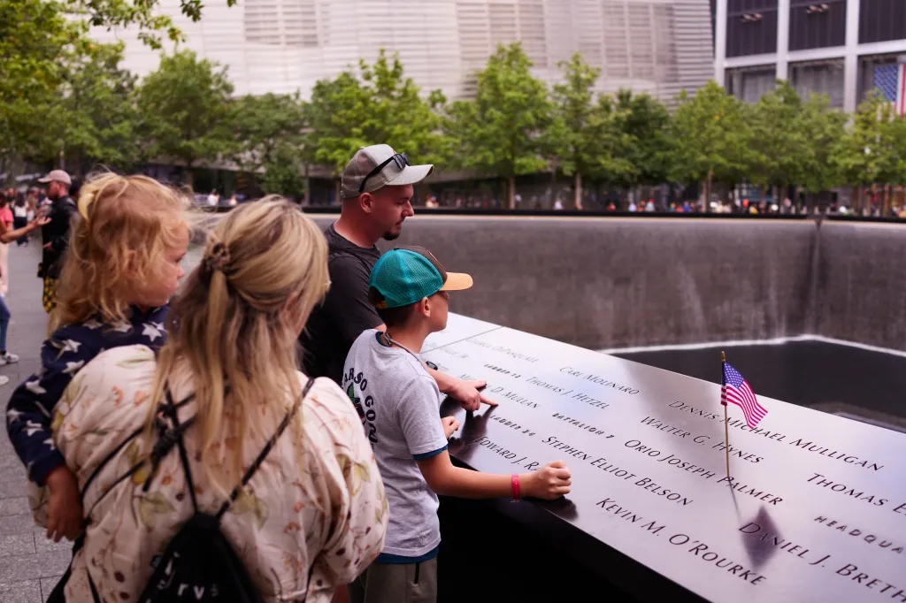 People gather at the National September 11 Memorial & Museum on Tuesday, September 9, 2025, in New York City. The memorial and museum, part of the World Trade Center complex, honor the 2,977 victims of the 2001 attacks and the six people killed in the Feb. 26, 1993, World Trade Center bombing.