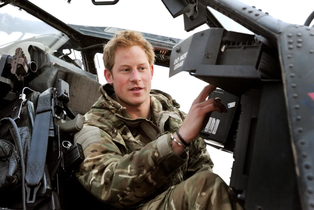 Prince Harry conducting early morning checks in an Apache helicopter.