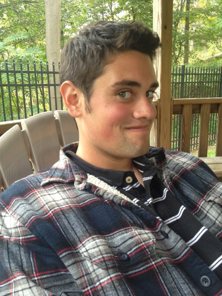 Nick Reiner sitting on a porch.