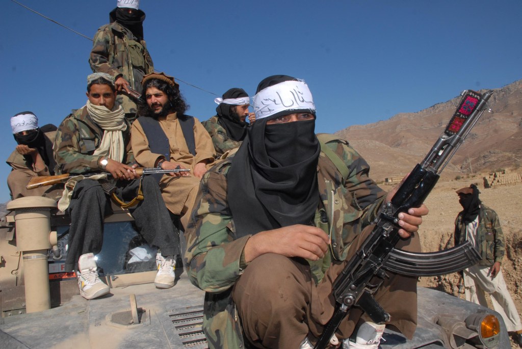 Pakistani Taliban commander Latif Mehsud (center) and other militants.