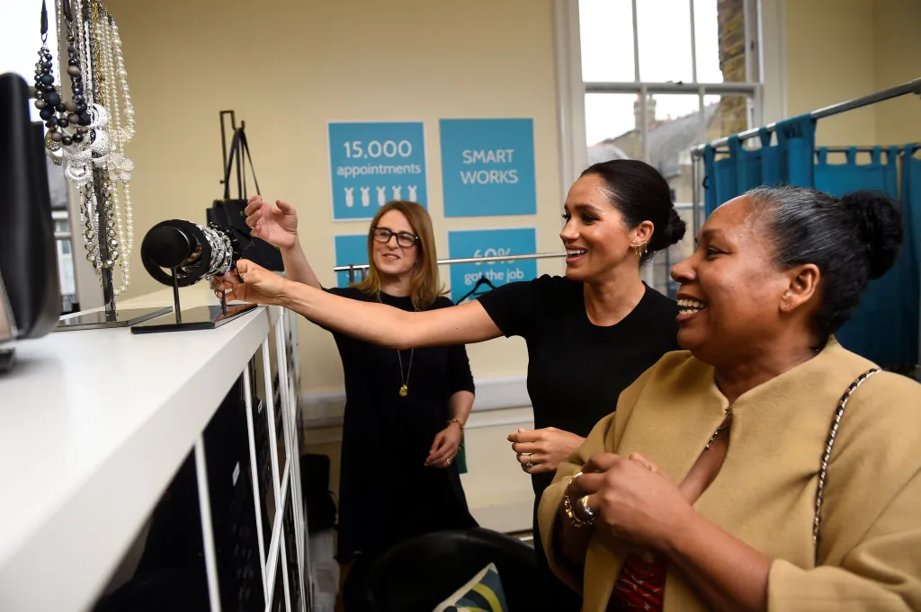 Meghan, Duchess of Sussex, helping Patsy Wardally pick out clothes during her visit to Smart Works.