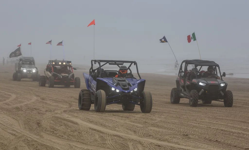 Off-road vehicles on the sandy beach at Oceano Dunes State Vehicular Area.