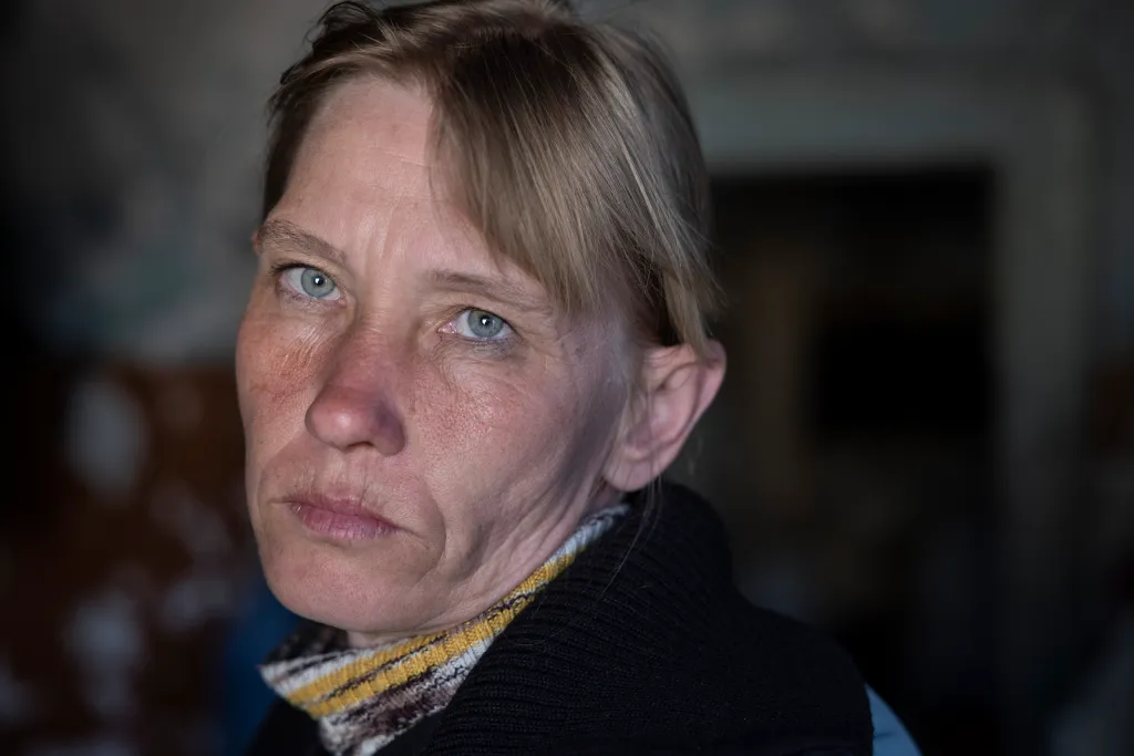 Viktoria, a rape victim in Berestyanka, Ukraine, looks into the camera.