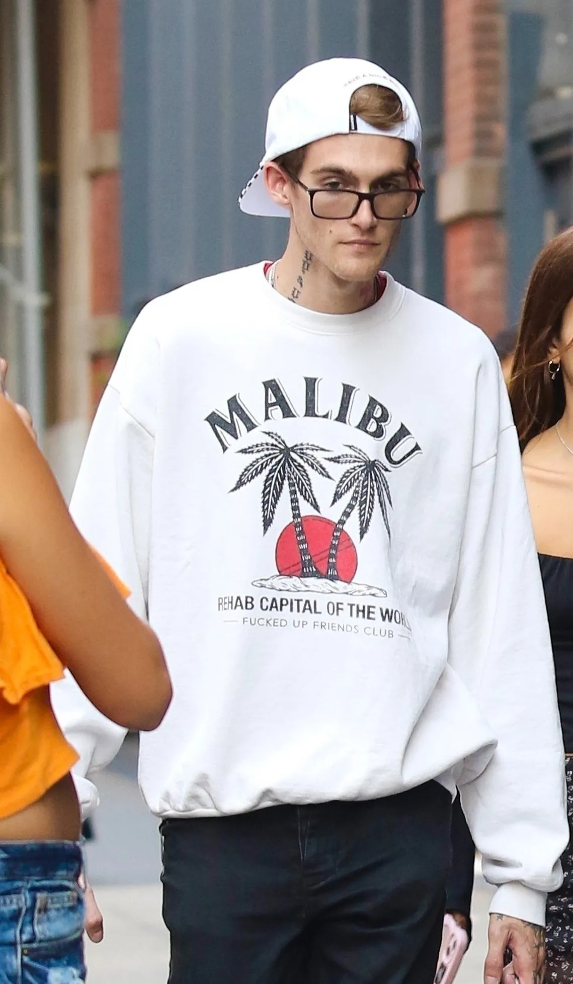Presley Gerber wearing a white sweatshirt with 