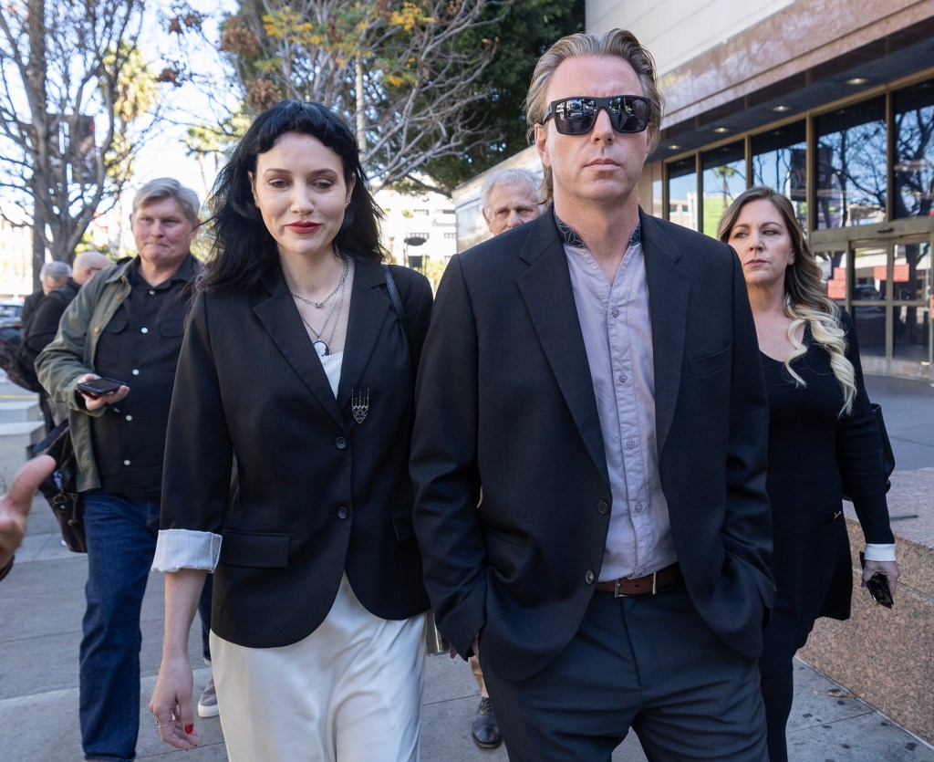 Elijah Blue Allman and Mariangela King exiting the courthouse with their lawyers.
