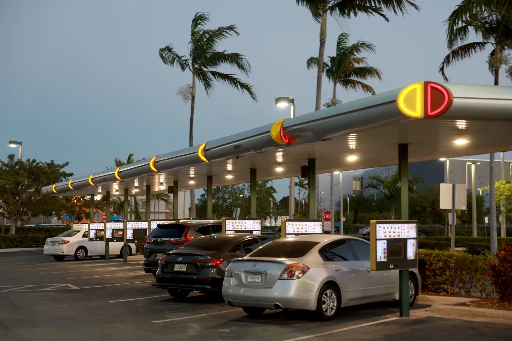 Customers wait in their cars for orders at a Sonic Drive-In restaurant.