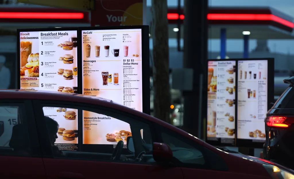 A customer waits in the drive-thru lane at a McDonald's restaurant.