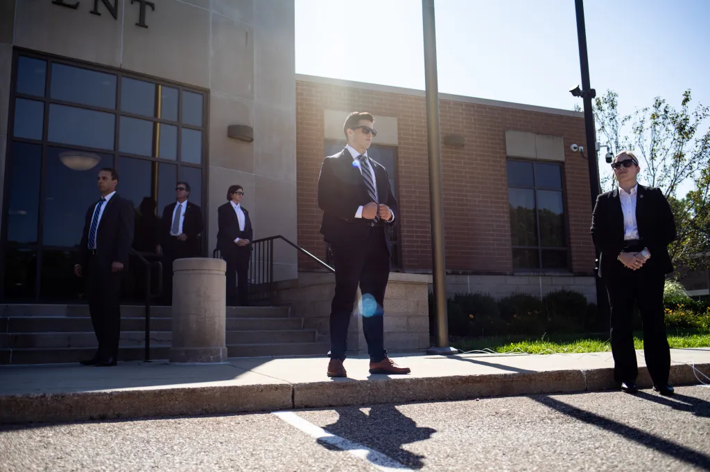 Secret Service agents monitoring a press conference where Vice Presidential Candidate JD Vance spoke in Shelby Township, Michigan.
