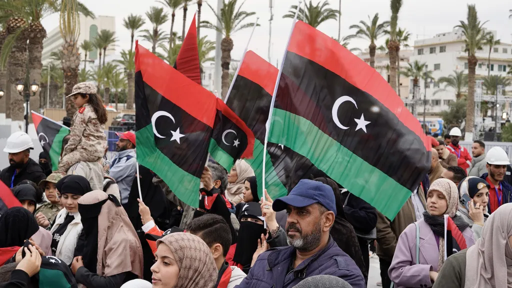 People wave Libyan flags in Martyrs' Square during the 14th anniversary of the February 17 Revolution.