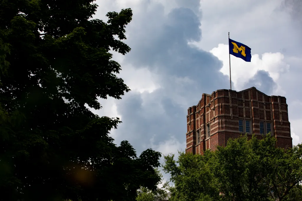 A University of Michigan flag flies on the Michigan Union building.
