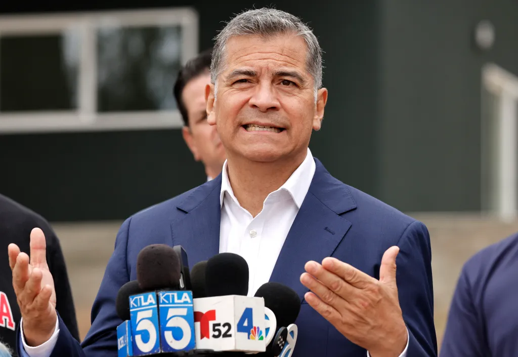 California Democratic gubernatorial candidate Xavier Becerra speaks to the media at an Eaton Fire recovery site in Altadena, California.