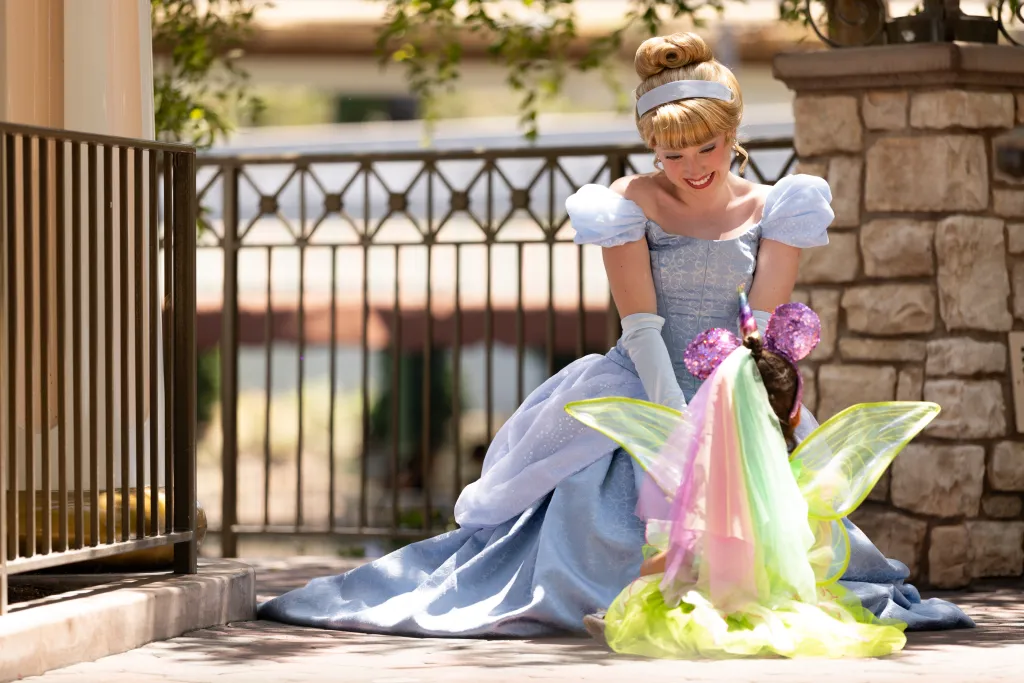 Cinderella interacts with a child in the 