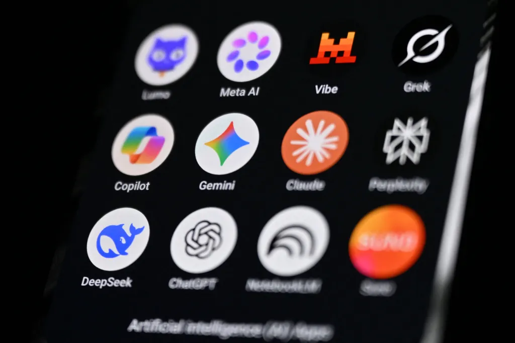 A handheld smartphone displays the icons of some of the main artificial intelligence-based apps, including logos, from left, of Proton AG's Lumo, Meta AI, Mistral Vibe, xAI's Grok, Microsoft's Copilot, Google's Gemini, Anthropic's Claude, Perplexity, Deepseek, OpenAI's Chat GPT, Google's Notebook LLM and generative AI music app Suno.