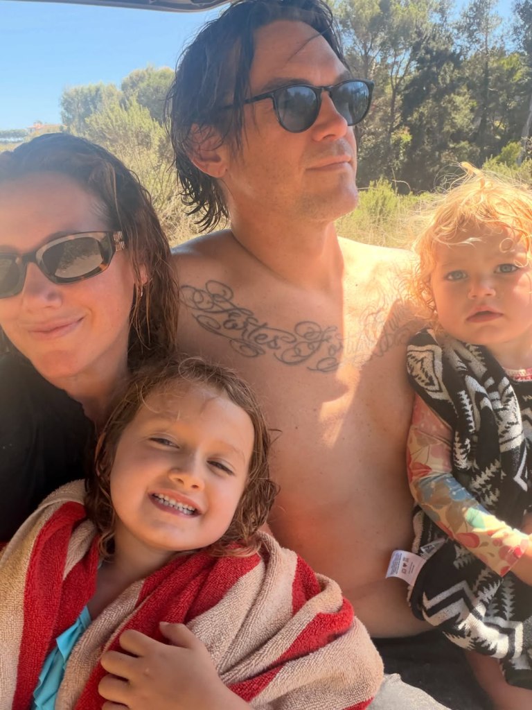 Ashley Tisdale and family enjoying a sunny day outdoors.