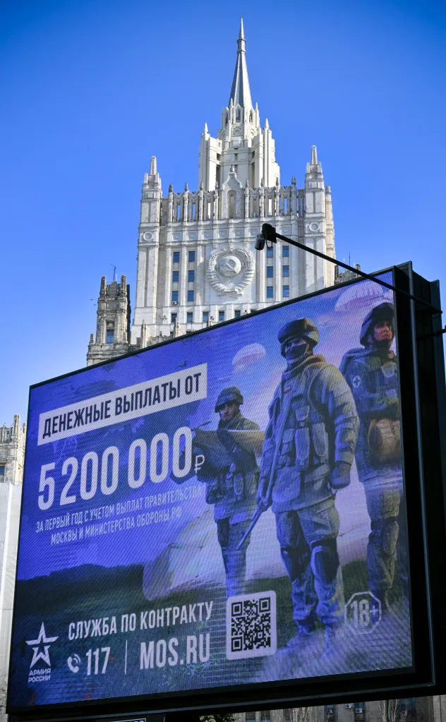 A billboard in Moscow advertises contract army service with a sign stating 