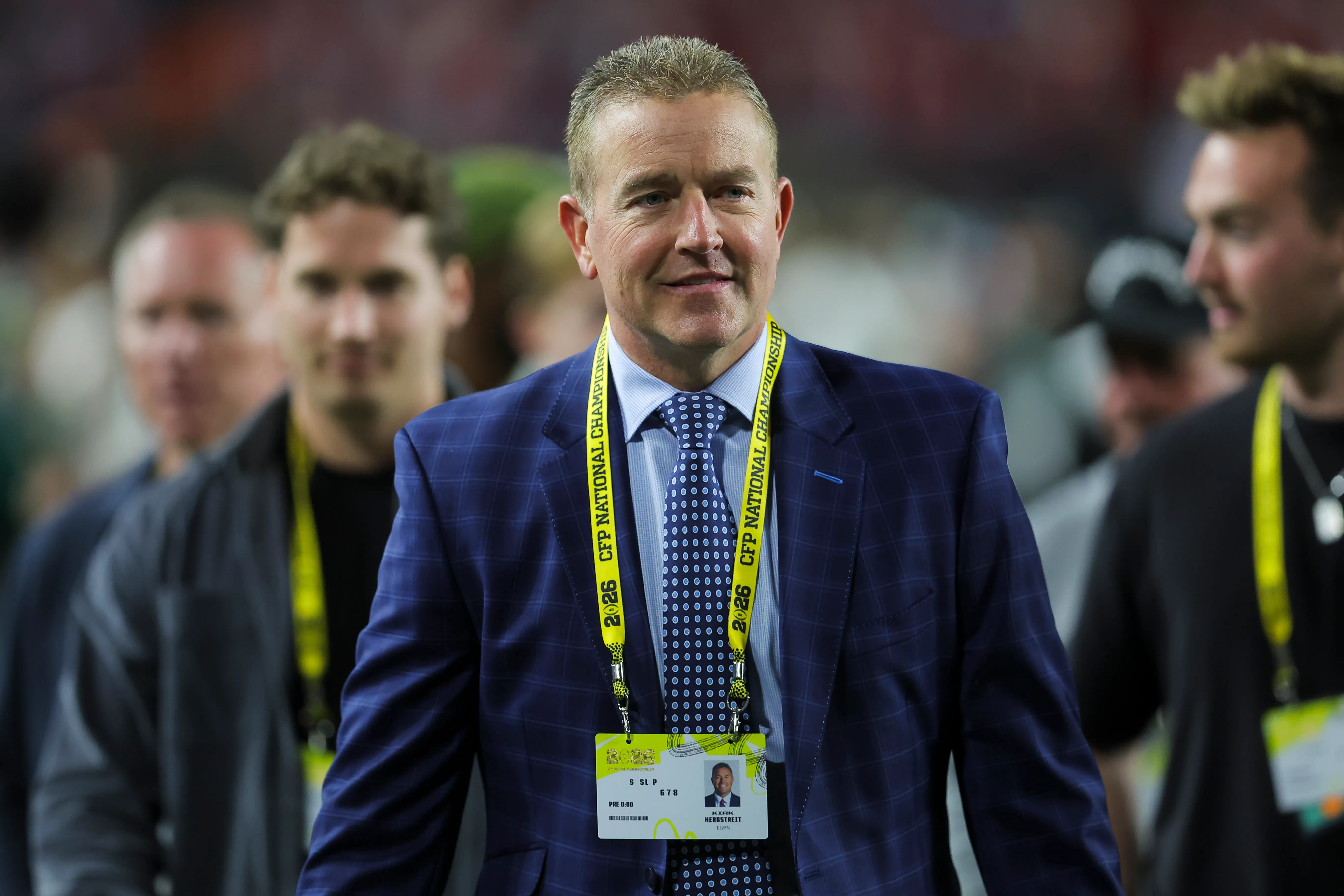 ESPN sportscaster Kirk Herbstreit on the field before the 2026 CFP National Championship.