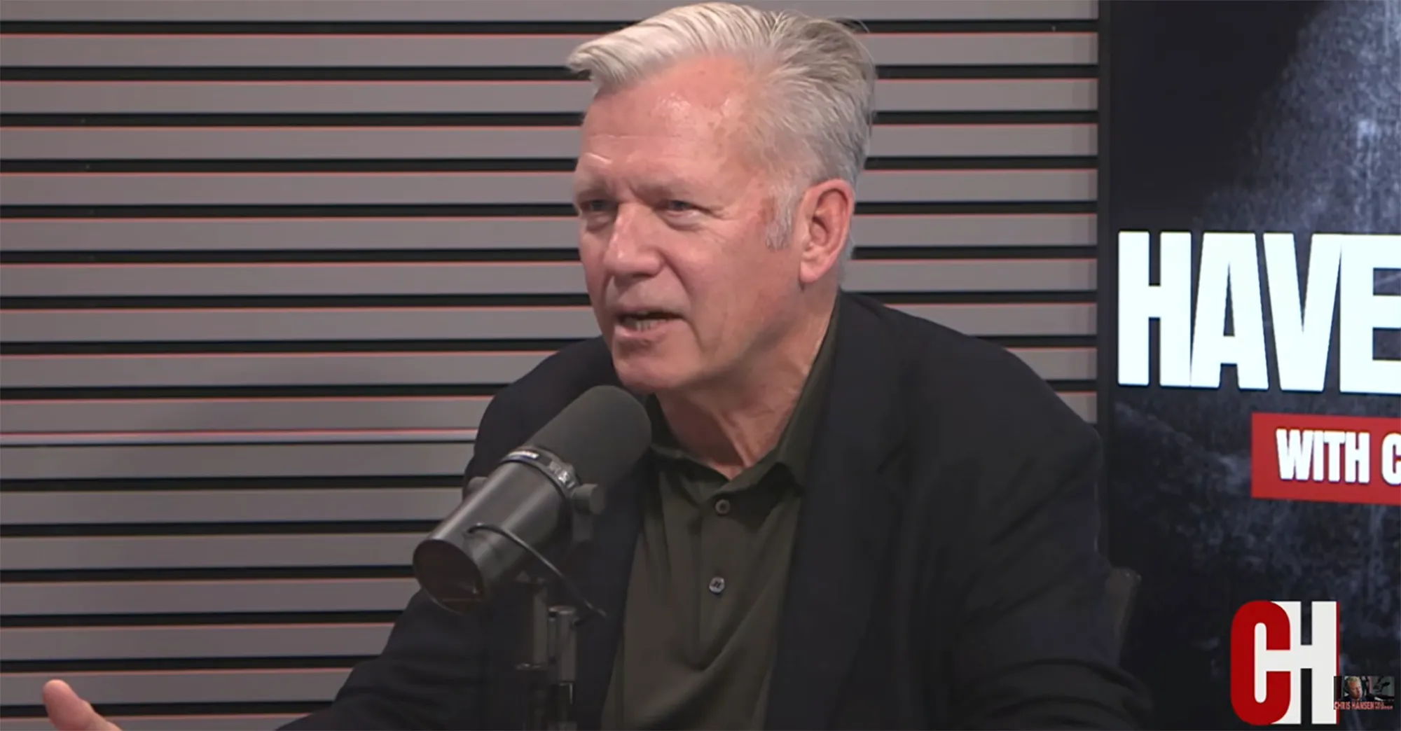 Chris Hansen speaking into a microphone.