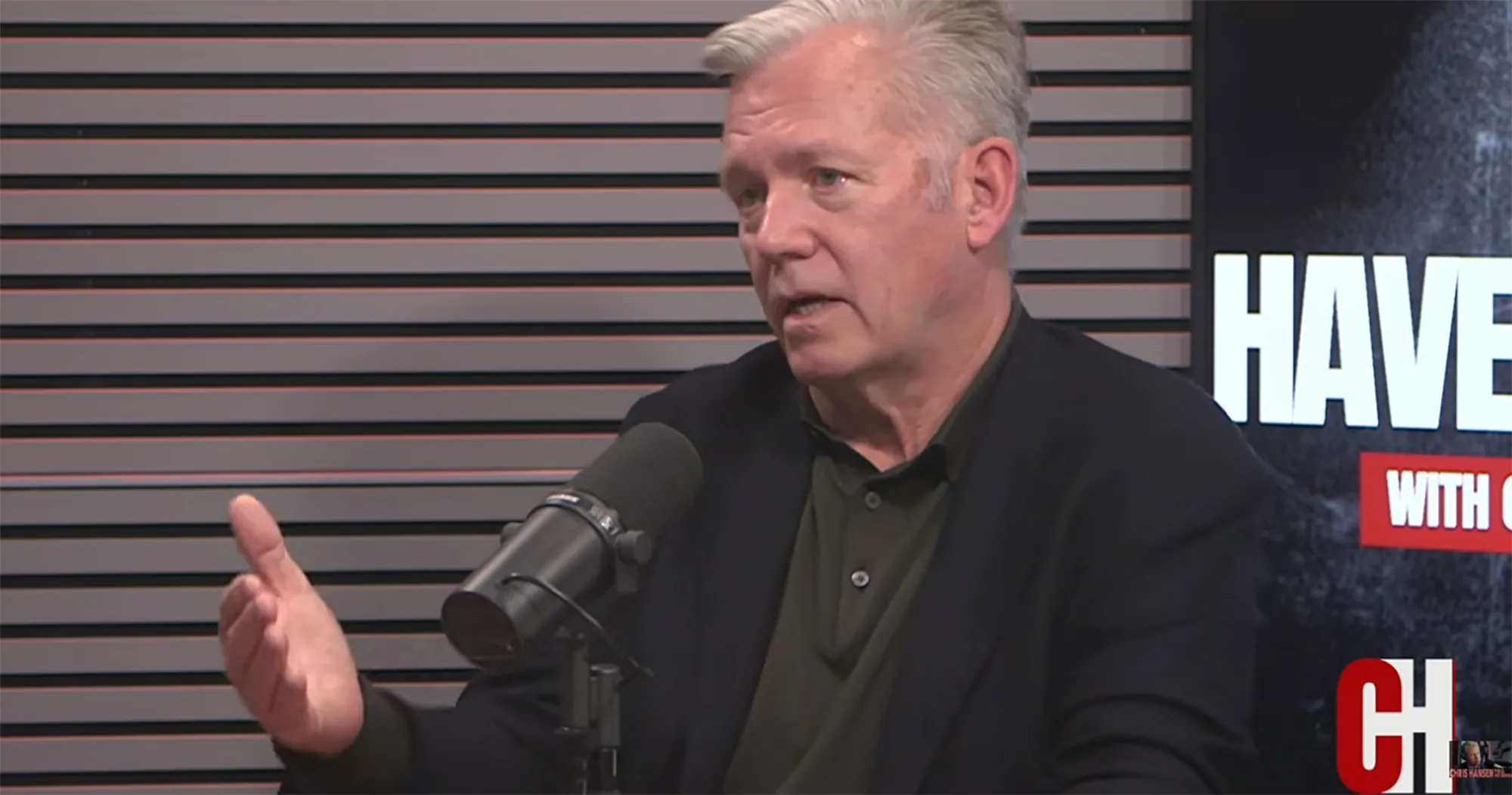 Chris Hansen speaking into a microphone.