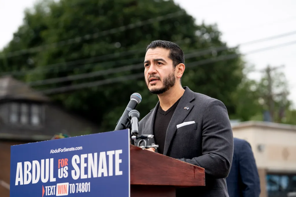 Michigan Senate candidate Abdul El-Sayed speaking at a podium.