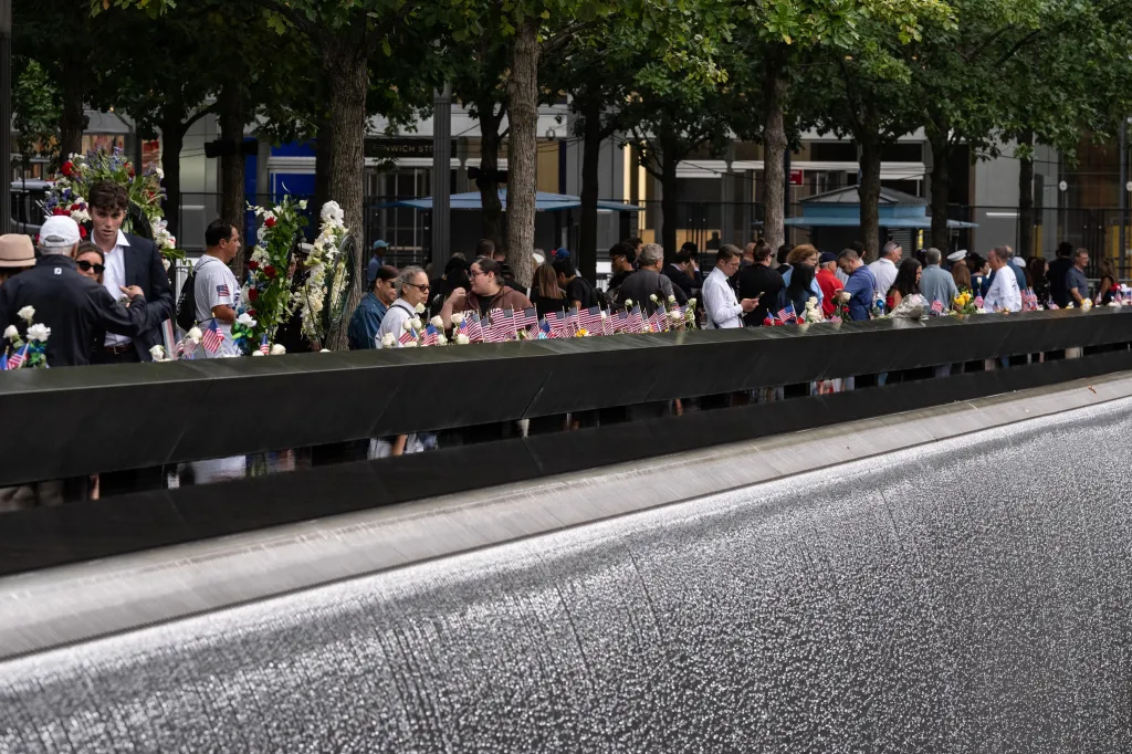 People attending the 25th Anniversary Commemoration Ceremony at the National 9/11 Memorial and Museum.