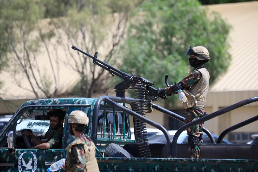 A Houthi trooper mans a machine gun on a pickup truck while on patrol in Sana'a, Yemen.