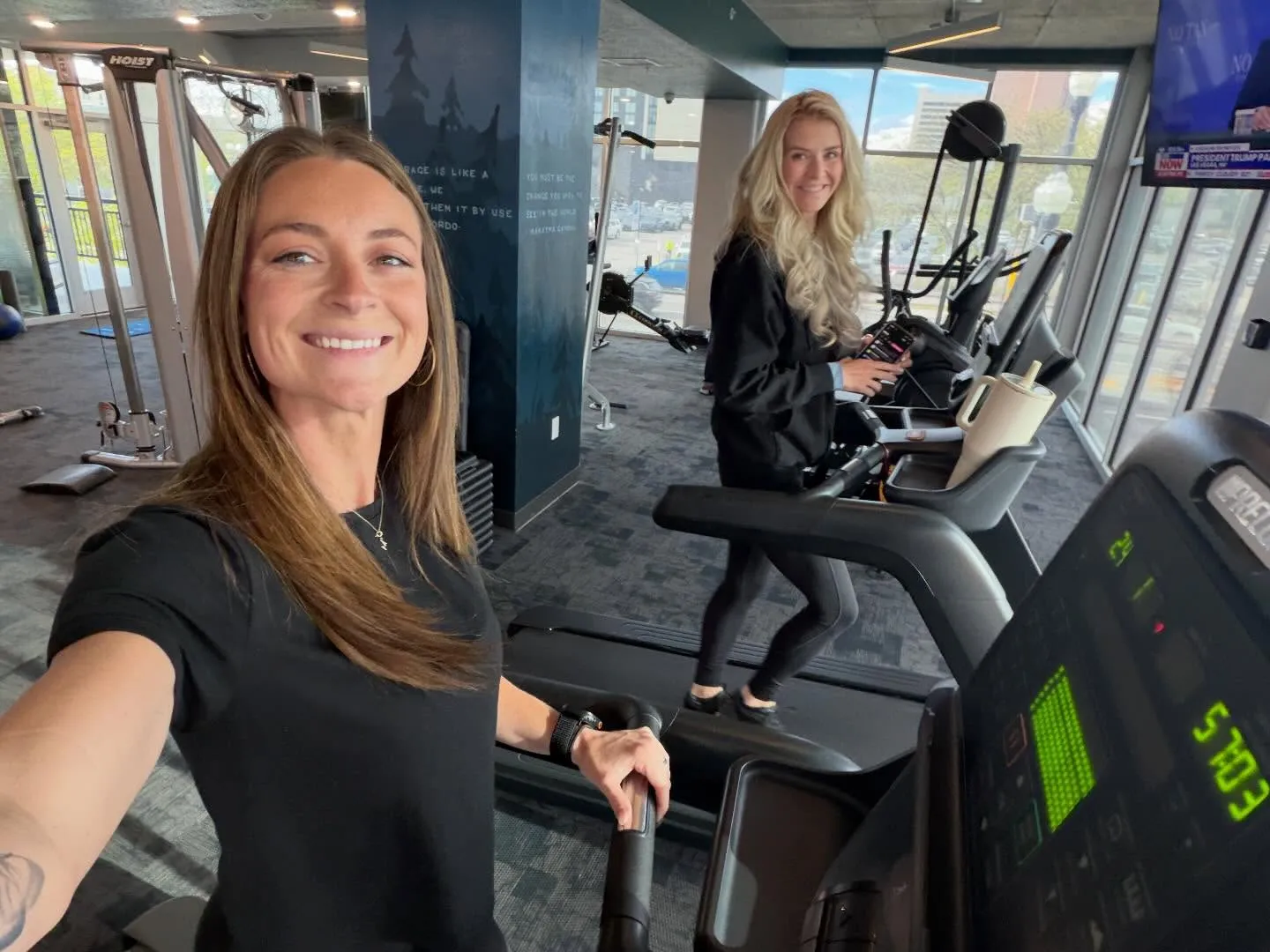Elizabeth Smart Gilmour and Mackenzie Paralee Holsombake on treadmills.
