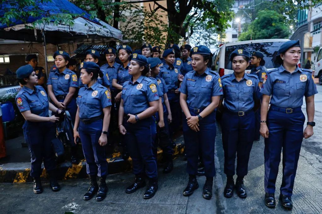 Philippine police officers outside the Hall of Justice in Quezon City.