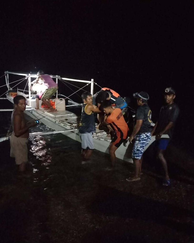 People participating in a rescue operation at night in Palawan, Philippines.