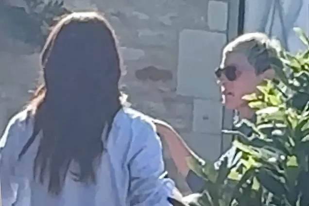 Meghan Markle and Ellen DeGeneres talking outdoors.