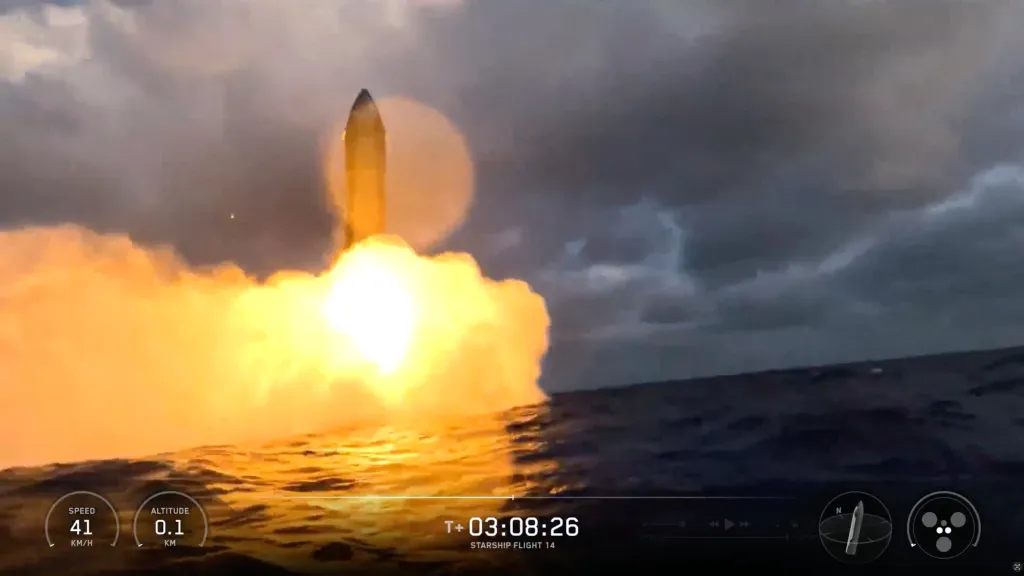 SpaceX Starship makes a fiery landing at sea during its 14th test flight.